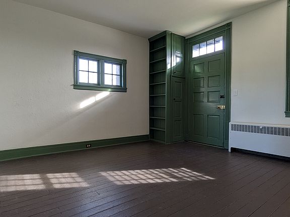 Living Room with historic front door and cabinets