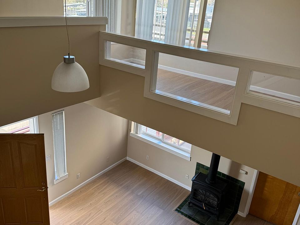 view of office loft and living area below