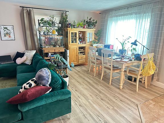 Plenty of natural light pours over the dining area and living room, perfect for growing plants! House is east facing.