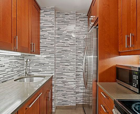 3rd image of 23 E 10th St APT 2A