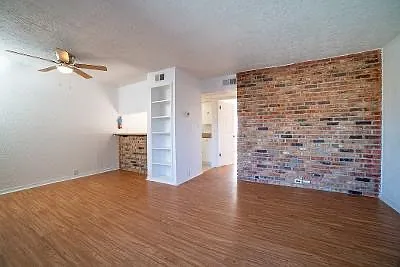 APT 33 - living & Dining area. Most apts have similar lay outs. Sizes Vary a little bit. The Brick is in each apt. Colors will vary per apt.