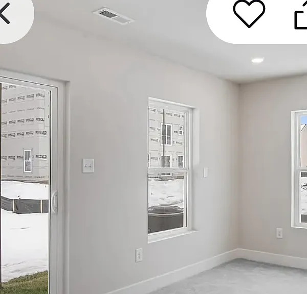 Lower level room has wal out door