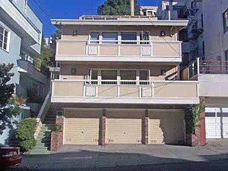Front of building. The unit is the highest of two with front decks. Parking and storage are behind center garage door.