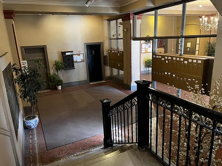 Looking from landing into lobby toward the building's two elevators.