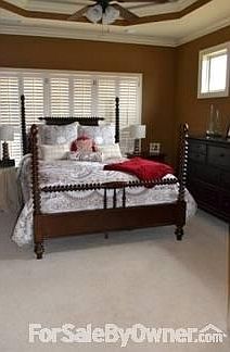 Master Bedroom with feature windows
						:
						Feature windows, tray ceiling with accent lighting, door opens to back deck.