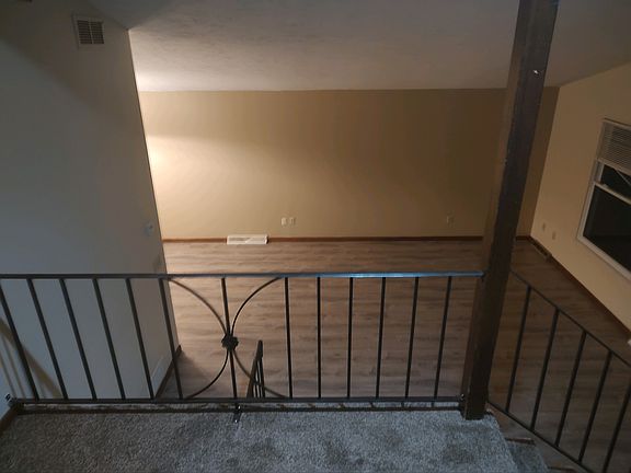 Living room with vaulted ceilings and new LVT flooring