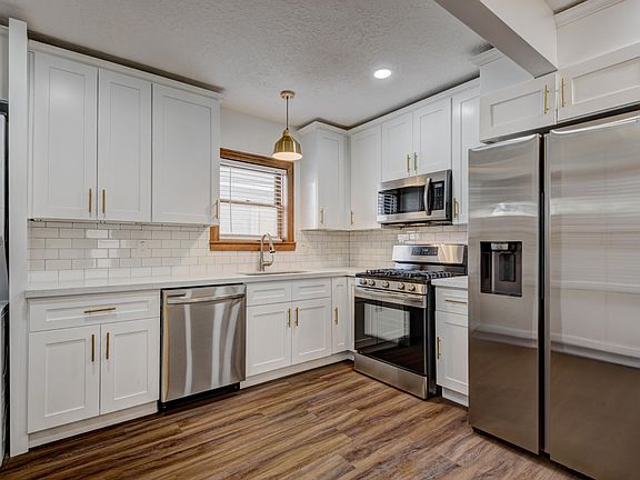 Upgraded appliances including brand new dishwasher, gas stove and fridge with indoor ice and water