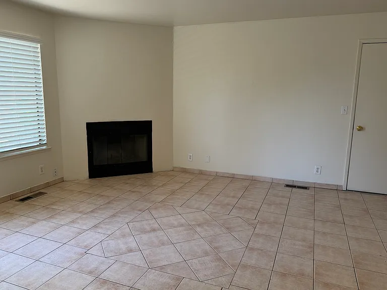 Tiled living room and Wood-burning Fireplace
Downstairs