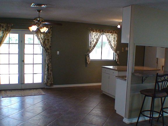 Bright, sunny kitchen opens to family room.