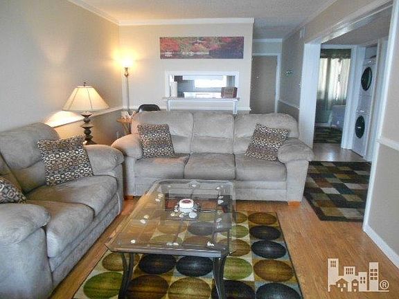 Combination living room kitchen with pass through.