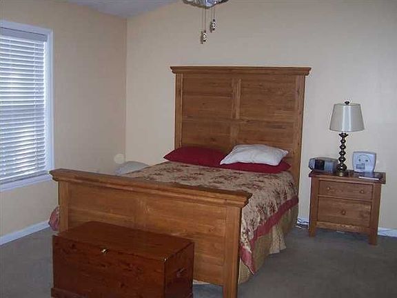 Master bedroom w/ vaulted ceiling