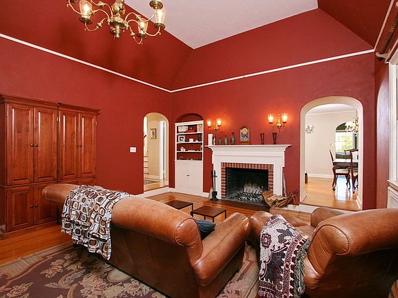 Formal Living Room
						:
						Wood burning fireplace, tile hearth, wood mantel and surround