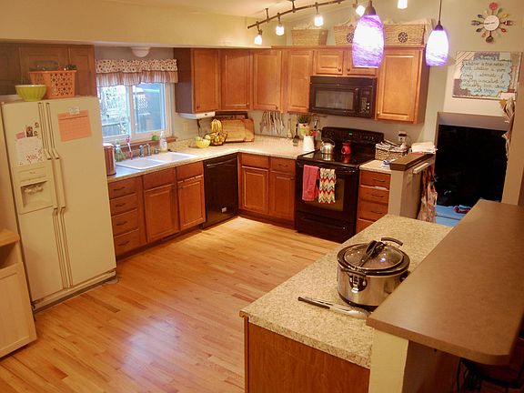 Open concept kitchen. Refrigerator has been replaced since t