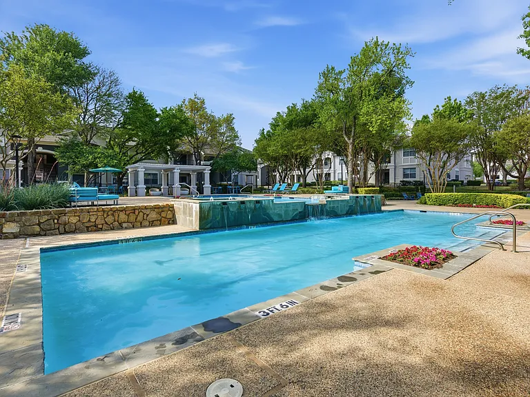 Community pool over looking waterfall and gazebo