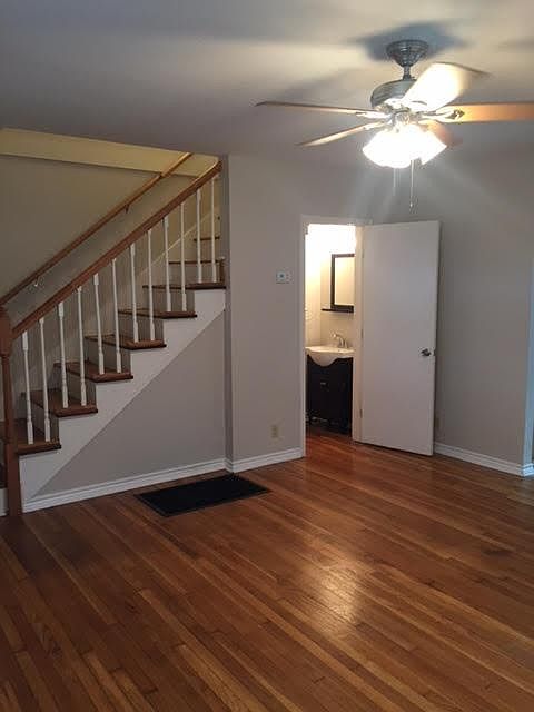 Front entry into main living space. Powder room access. Two large picture windows.