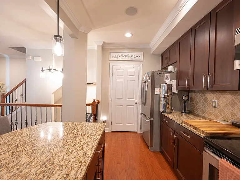 Fully stocked kitchen with shared pantry and fridge.