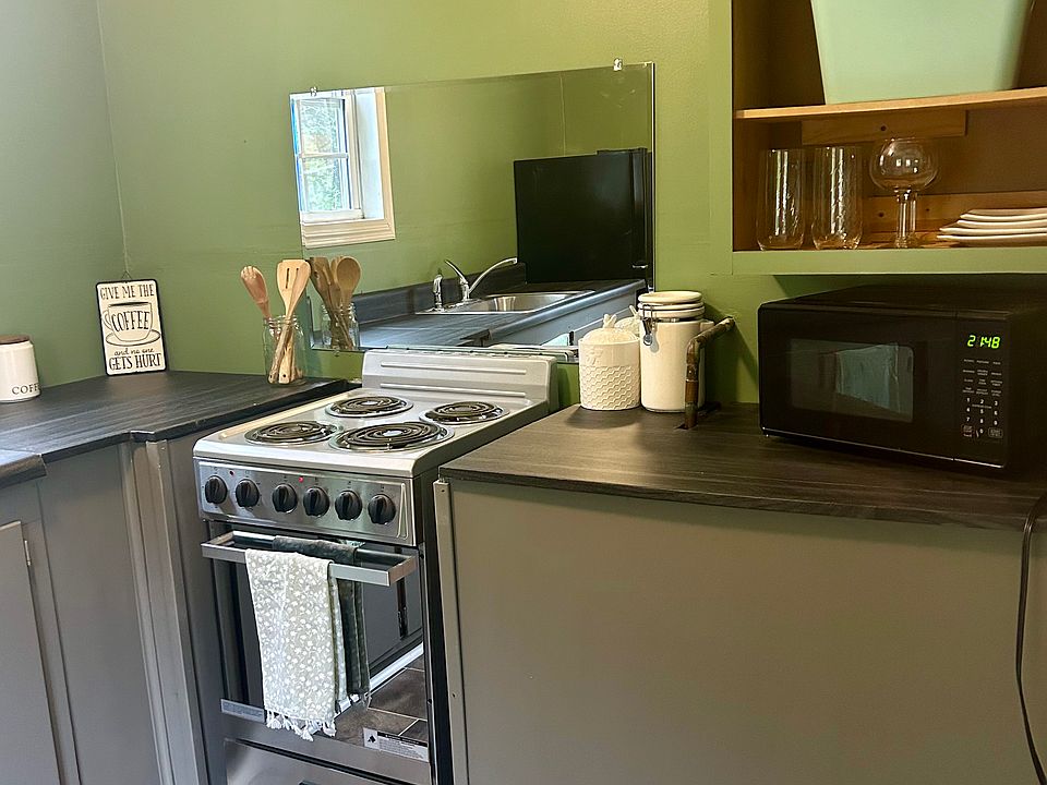 Kitchen with microwave provided.