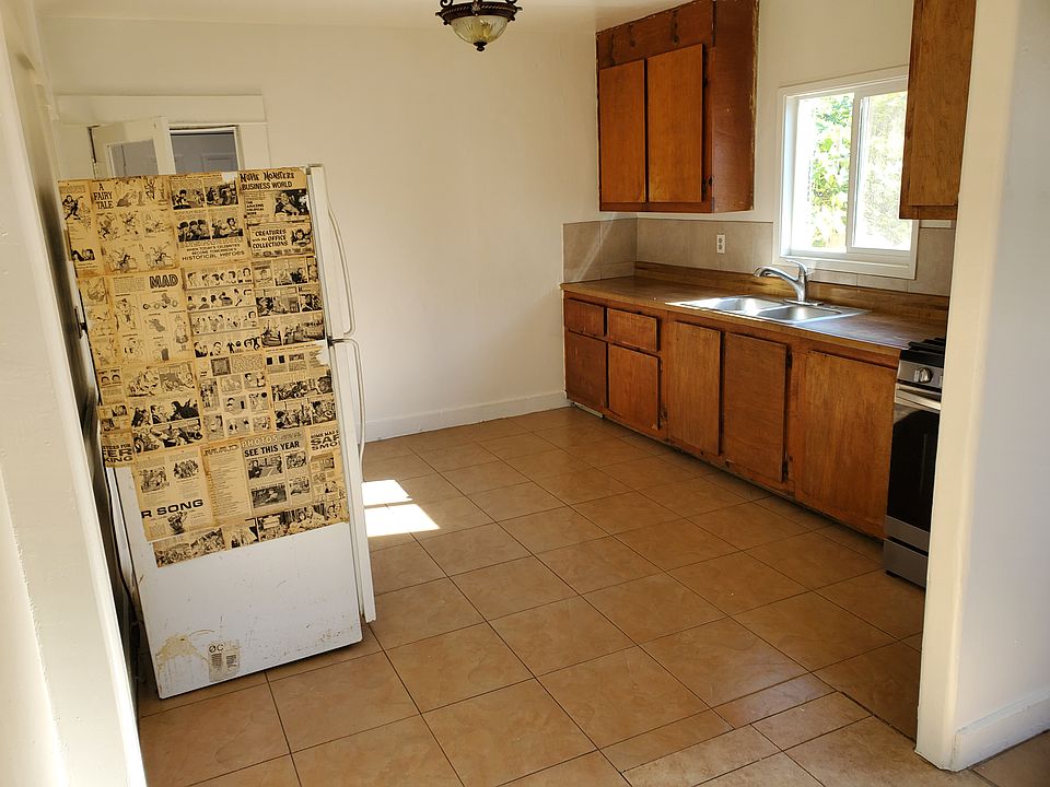 The horrible looking refrigerator is not there anymore.