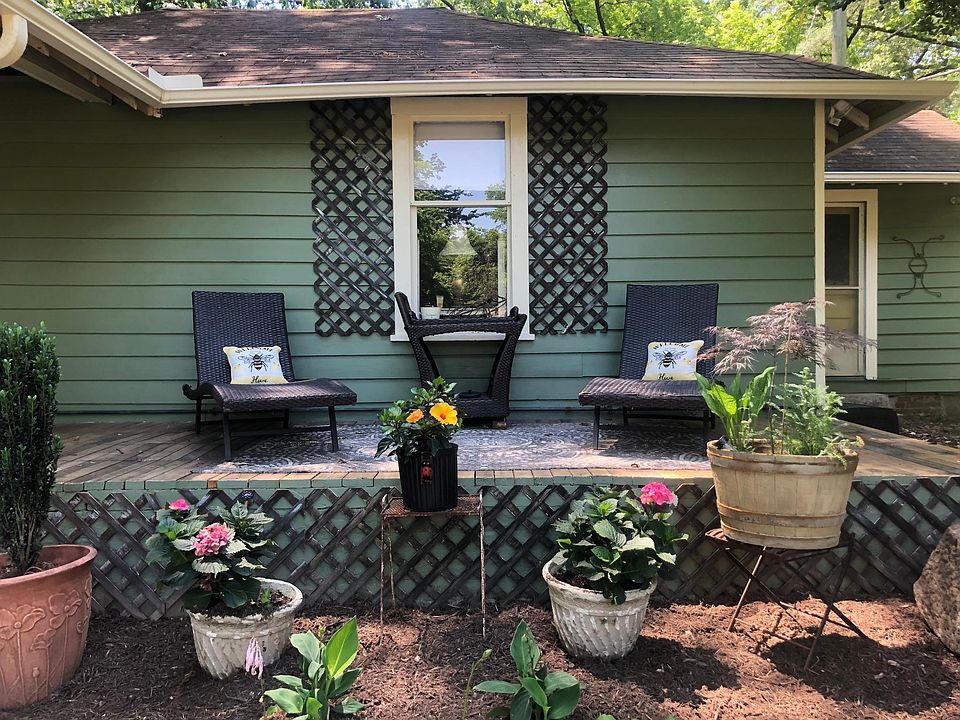 Guests enjoy their coffee, wine and conversations on the long patio. There is a server that will hold your snacks and wine bucket.
