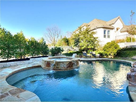 Yes you will think you've moved into a resort with this fabulous in-ground pool and spa surrounded b