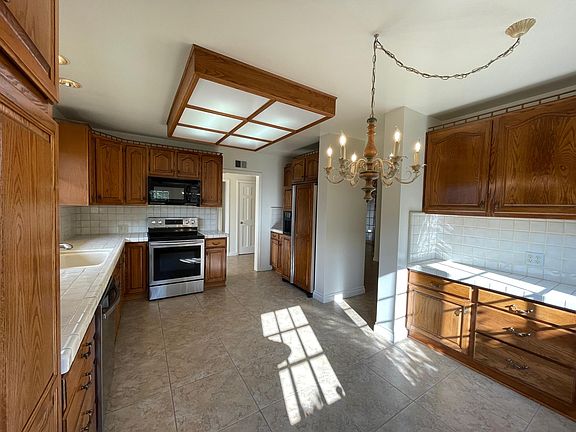 Fridge is included. Lots of counter and cabinet space. Dining area with a convenient side door to outside. Great sunlight.