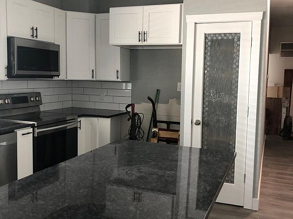 Upgraded kitchen with double door SS refrigerator and full pantry, SS smooth top electric cook top and oven with microwave over top and SS dishwasher.