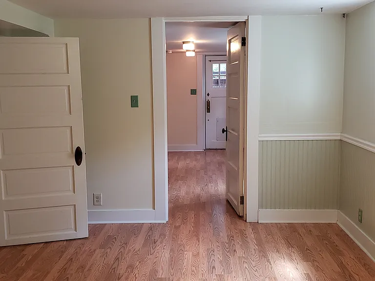 Room #2. Approx 10'x15', with south-facing window for all-day light. Looking back into living room to Unit B front door.