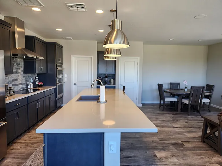 Huge kitchen island with pendant lights