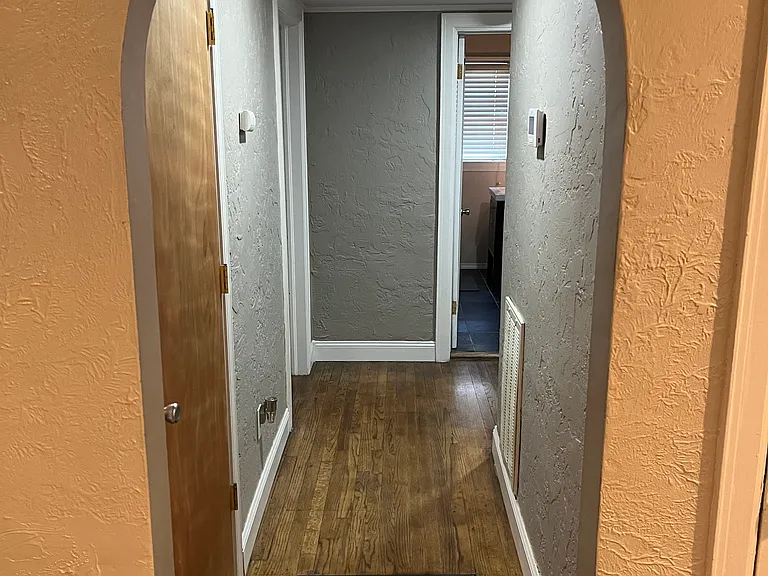 Hallway to bedrooms and bathroom looking South.
