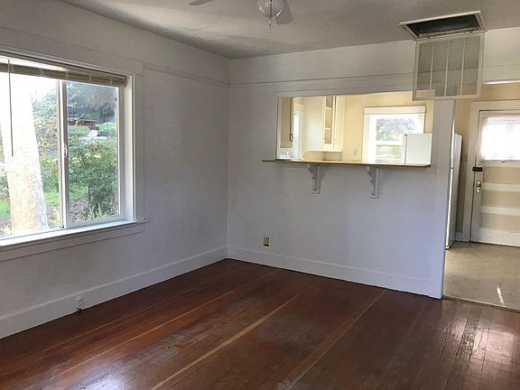 living room looking into kitchen, back door