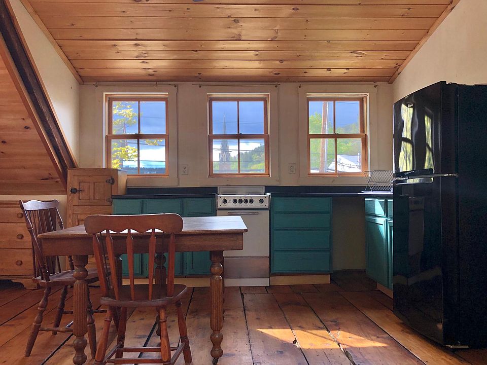 Kitchen area with view to Montpelier including seasonal view of Montpelier's statehouse golden dome.