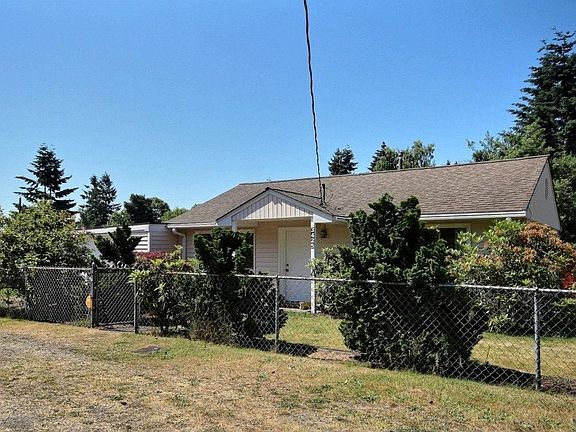 Corner house with plenty of parking.