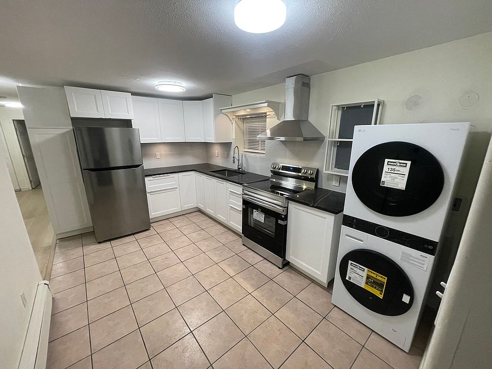 Kitchen with all new appliances. Brand new Fridge, new stove and brand new LG washer/dryer