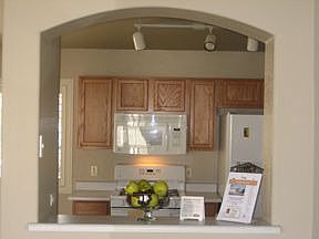 From formal dining area into kitchen.