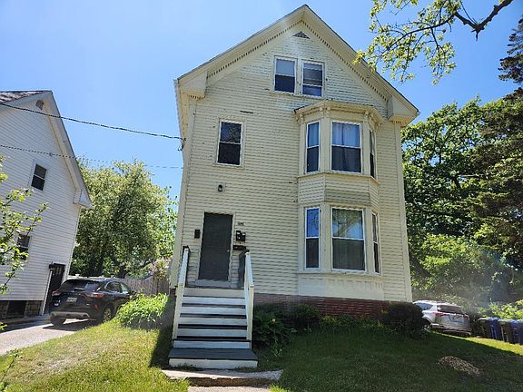 Exterior, unit is on 2nd floor of 3 unit building, parking out front for 1 car.