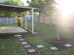 French patio doors lead into this outdoor haven with new SOD 