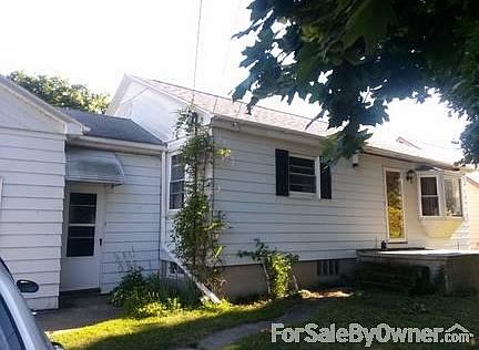 Front - North Facing
						:
						Front view of house from concrete driveway.