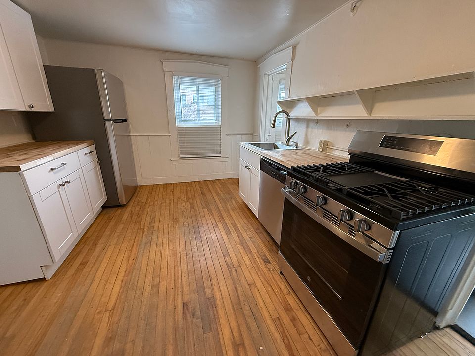 Kitchen with gas stove, dishwasher and new appliances