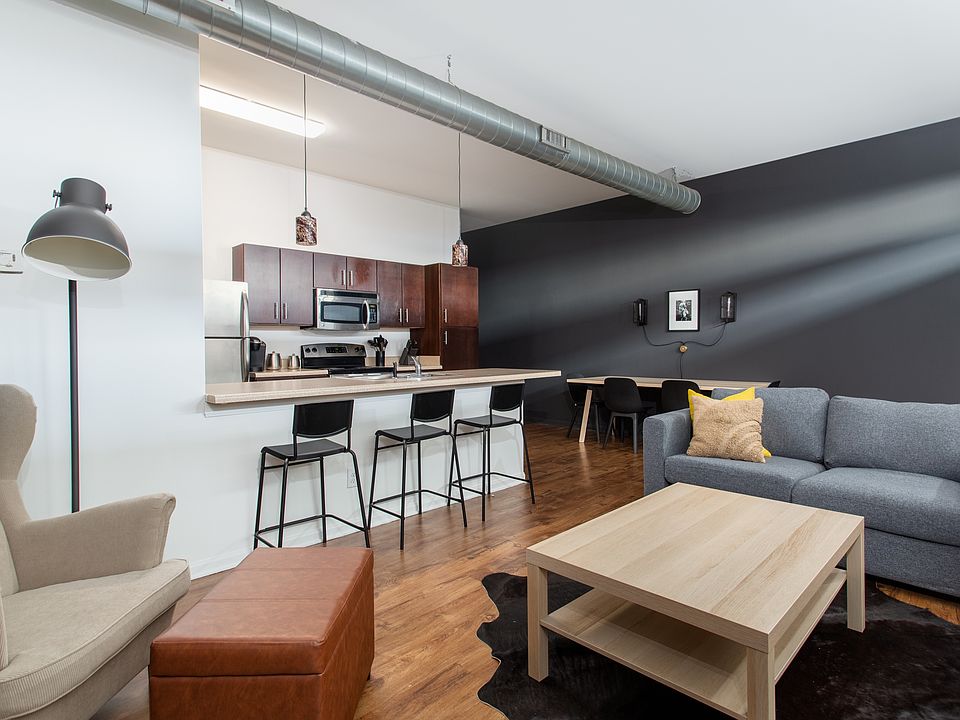 Open floorplan Exposed ductwork 10 foot ceilings Wood floors!