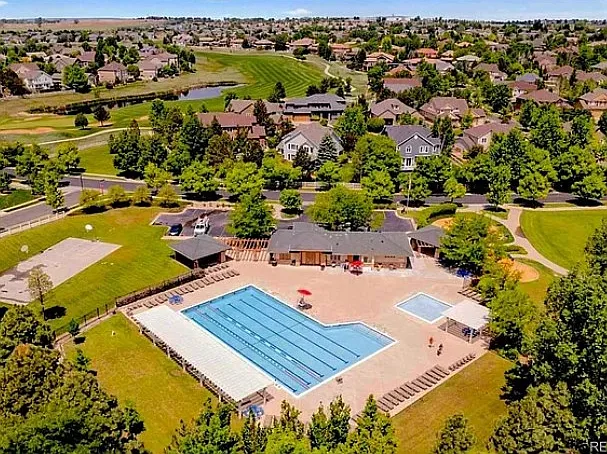 Aerial vie of neighborhood pool and surrounding golf course, just a 10 min walk away