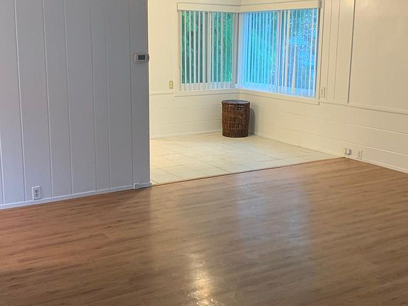View of the living room and dining area as seen from the front door