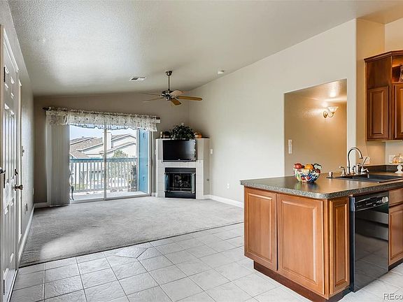 Living room with fireplace and balcony