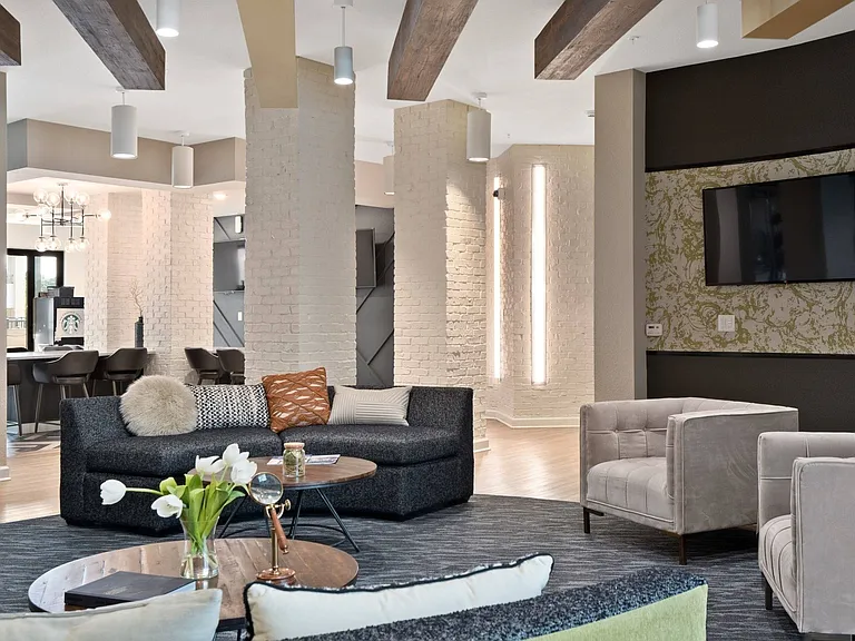 Clubhouse with TVs and coffee bar