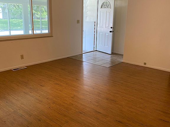 Living room with vinyl flooring.
