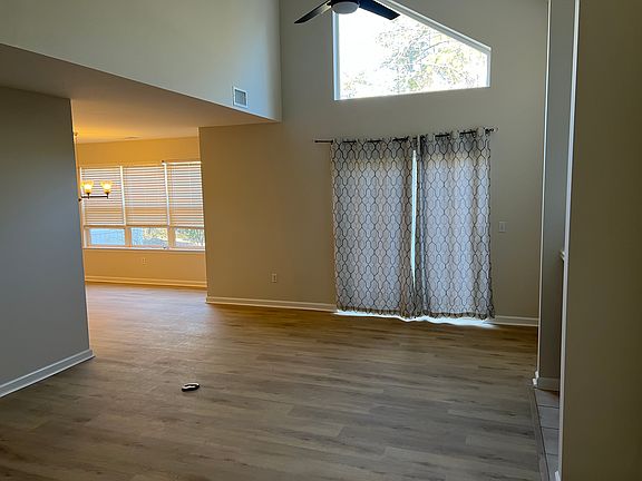 Living room, facing patio door and dining room