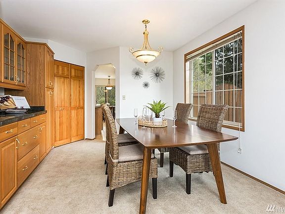 Formal dining room with useful built-in cabinets.