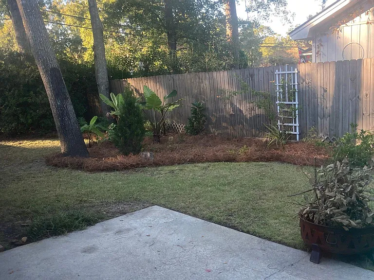 Lovely back yard patio with party lights- great for entertaining.