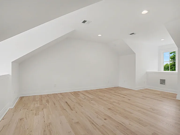 A Spacious Third_Level Bedroom that Provides a Serene, Tucked_Away Retreat.
