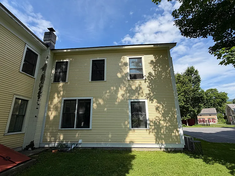 West side of unit facing Mount Equinox. Wonderful views when the leaves are off and partial views in the Summer. First floor windows have blackout shades installed.