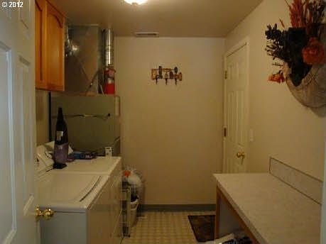 In-side Utility Room w/cabinets & work space